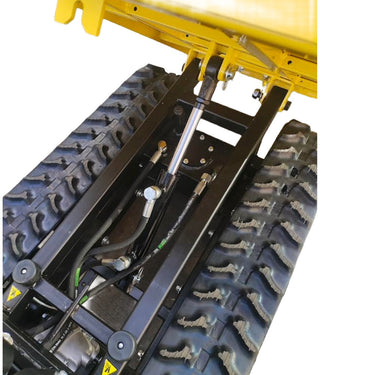 Close-up of a yellow construction vehicle's undercarriage with tracks and suspension components.
