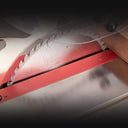 The special transparent blade guard provides visibility for aligning the saw blade with the intended line of cut. Both side barriers automatically adjust to the thickness of the advancing workpiece.