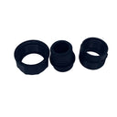 Three black plastic threaded adapter collars arranged horizontally on a scratched light gray surface.