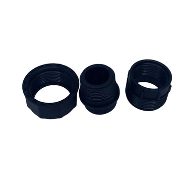 Three black plastic threaded adapter collars arranged horizontally on a scratched light gray surface.