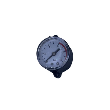 A small round mechanical pressure gauge with a white face and black casing, mounted on a scratched, light gray metal surface.