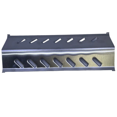 A stainless steel metal guard rail or channel with elongated oval cutouts, shown on a light gray workbench surface.