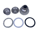 A set of replacement parts for a kitchen appliance, including a silver metal collar, a black rubber O-ring, a white plastic ring, and two small silver mesh filters, laid out on a white surface.
