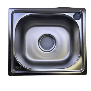 A square stainless steel sink basin viewed from directly above, set against a light gray background.
