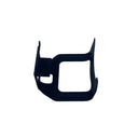 A black plastic replacement lens protector or camera lens hood mount, shown on a scratched light gray surface.