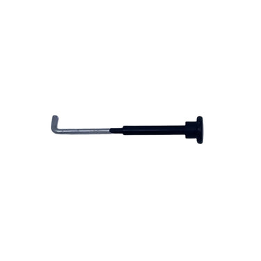 A small black and silver metal tool, possibly a small hex key or latch release, placed on a scratched, light gray surface.