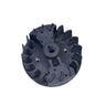 A used dark gray metal centrifugal pump impeller, photographed on a scratched, light gray surface.