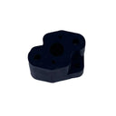 A small black plastic mechanical component or adapter, photographed on a scratched, light gray metal surface.