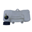 A translucent white plastic reservoir tank with a black cap and a brass filler tube, photographed on a scratched white surface.