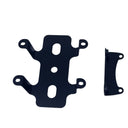 Two black metal mounting brackets placed on a white surface, photographed from above.