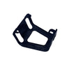 A black plastic mounting bracket or frame component, photographed on a white studio backdrop with visible surface scuffs and scratches.