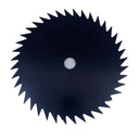 A circular black circular saw blade with sharp teeth and a central mounting hole, photographed on a light gray textured surface.