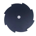 A black circular saw blade with a center hole, displayed on a white workbench surface.