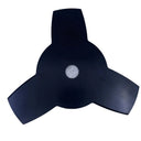 A black three-blade metal leaf or propeller blade with a central mounting hole, resting on a light gray scratched surface.
