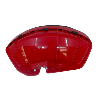 A glossy red plastic automotive part, likely a bumper cover or fender trim piece, photographed inside an open white photo box with cardboard floor visible at the bottom.