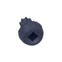 A single small gray metal screw or fastener placed on a scratched light gray surface.