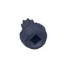 A single small gray metal screw or fastener placed on a scratched light gray surface.
