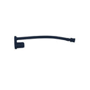 A small black plastic replacement part, possibly a handle pull or bracket, lying on a scratched, light gray metal surface.