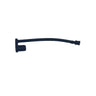 A small black plastic replacement part, possibly a handle pull or bracket, lying on a scratched, light gray metal surface.