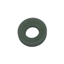 A small olive green rubber gasket or O-ring resting on a scratched, light gray metal surface.