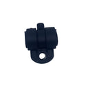 A small black plastic hardware component, possibly a bracket or connector, placed on a scratched light gray surface.