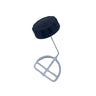 A small black plastic cap or lid component placed on a scratched, light gray surface.