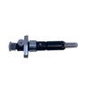 A used automotive injector component with a black body and silver metal fittings, resting on a scratched light gray surface.