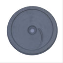 A circular gray plastic component with a central hole and a small curved slot, shown on a scratched light gray surface.